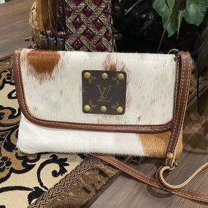Louis Vuitton insignia stamped , calf hair crossbody purse, lined